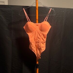 Amazon Women's Orange Bodysuit
